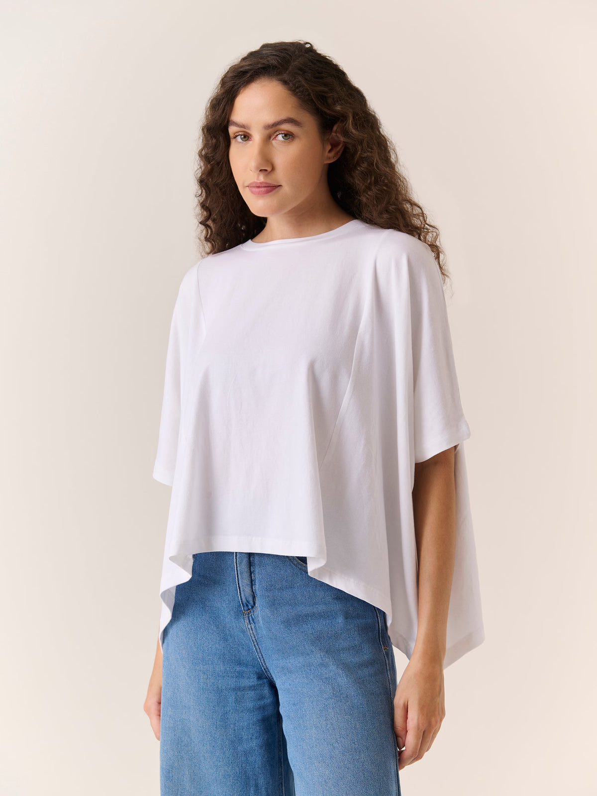 Relaxed Drape Top in White, worn by a model
