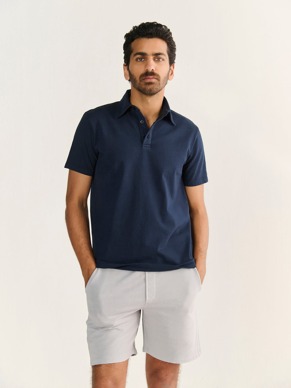 Heavy Short Sleeve Polo in Navy, worn by a model