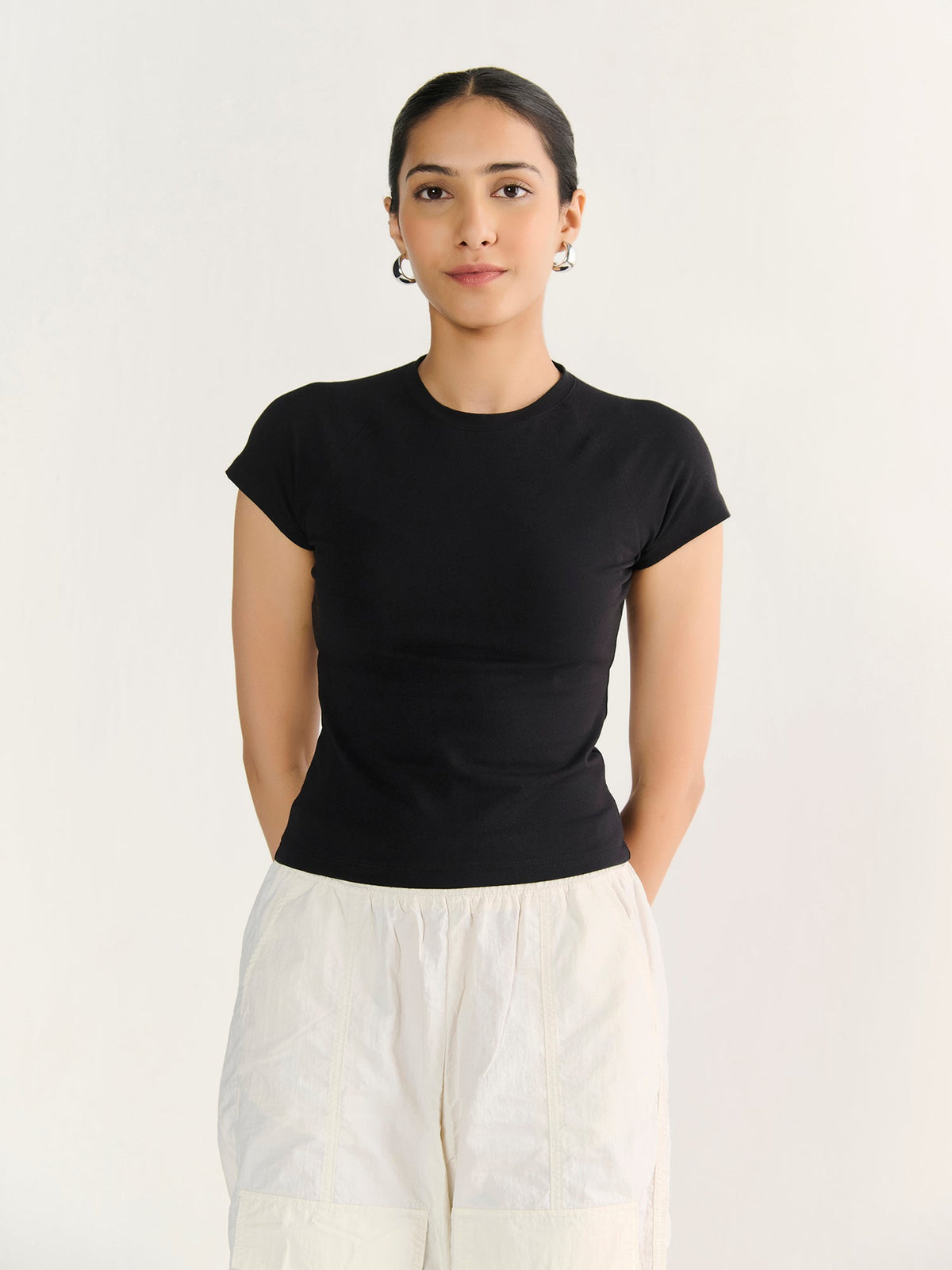 Fitted Tee in Black, worn by a model