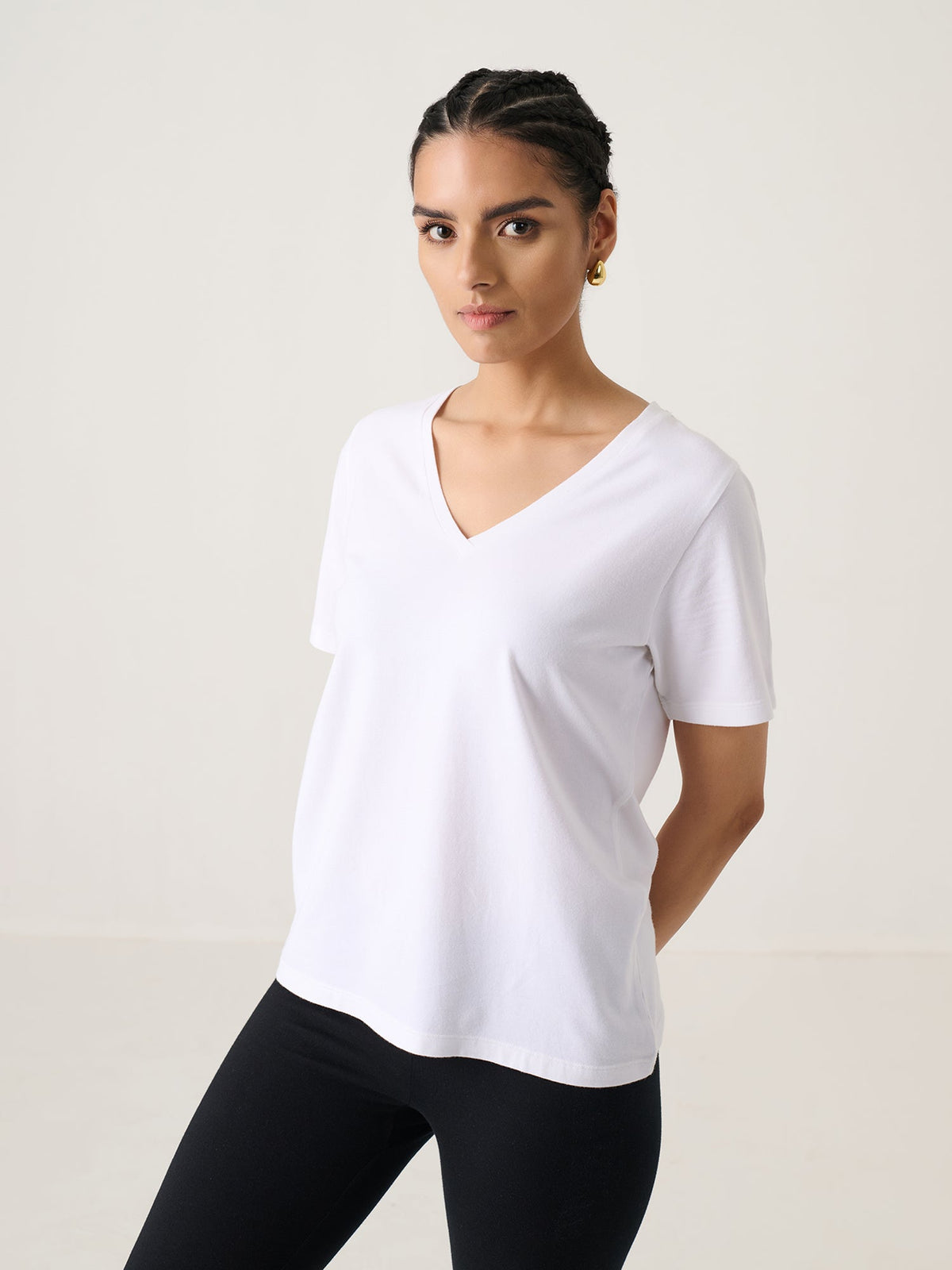 V Neck Short Sleeve in White, worn by a model