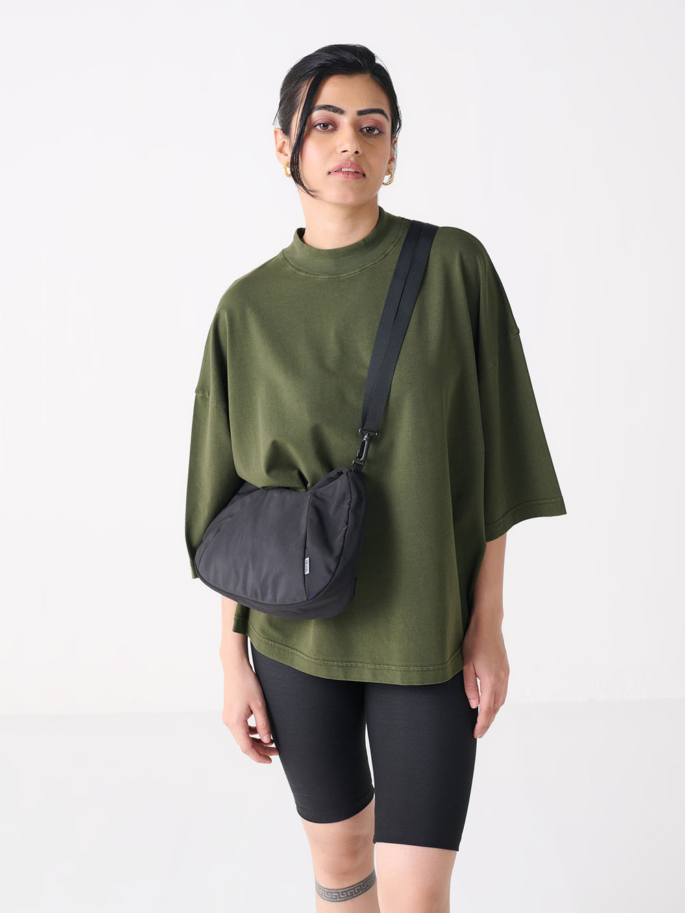 Oversized High Neck in Olive - front view on model
