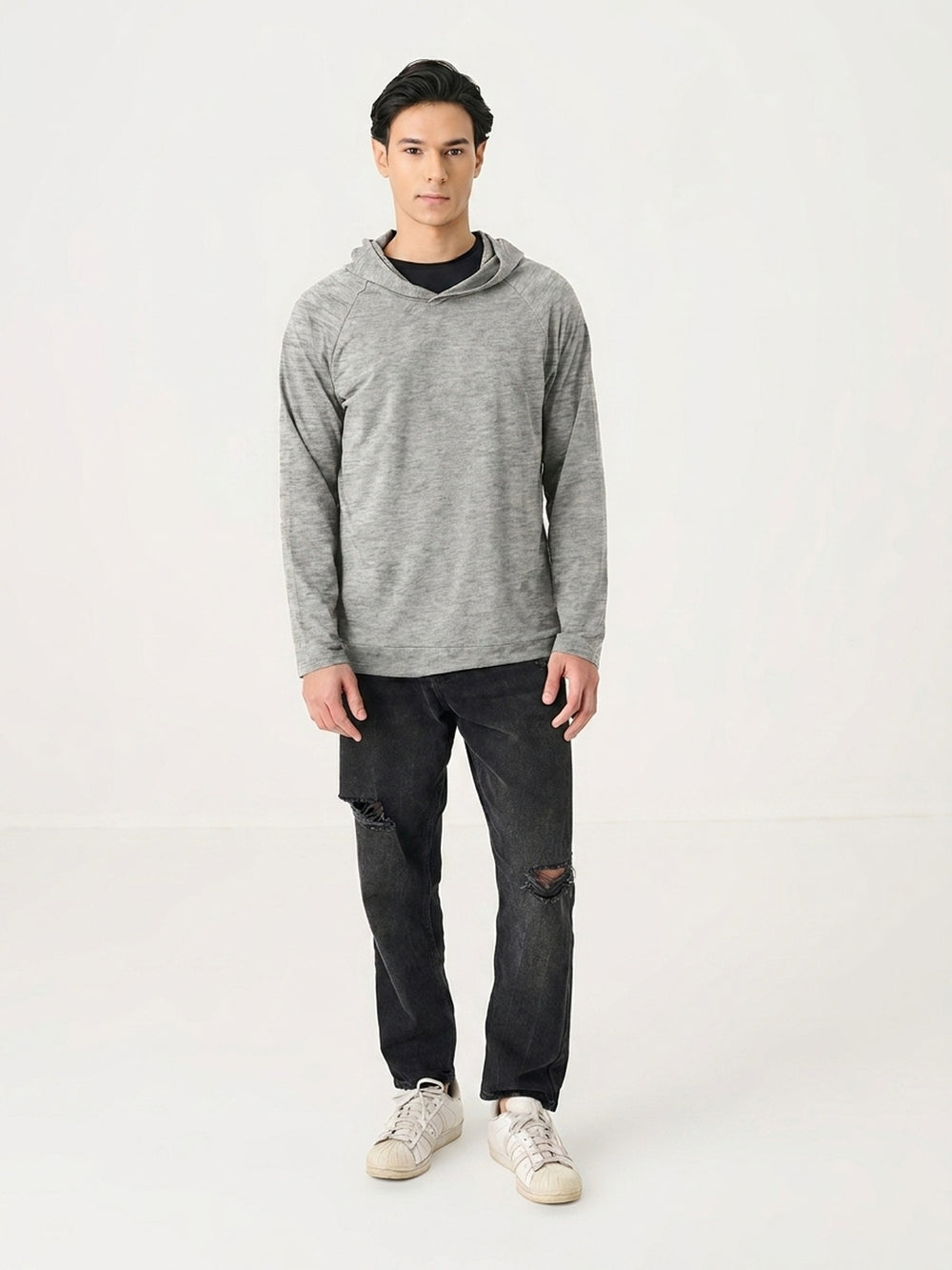 The Lightweight Hoodie in Grey Melange - front view on model
