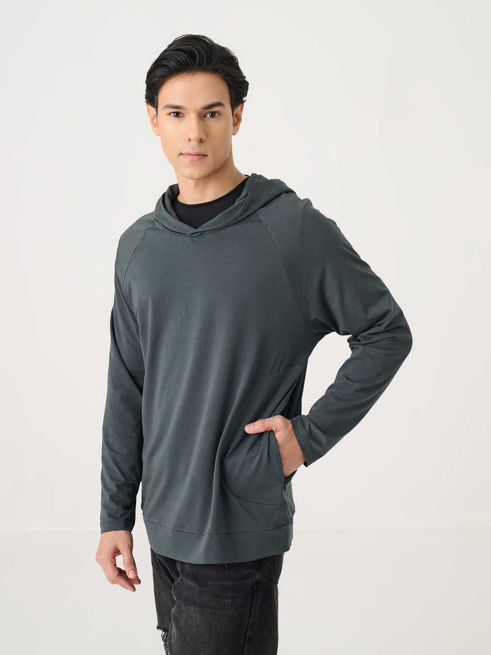 The Lightweight Hoodie in Charcoal - front view on model