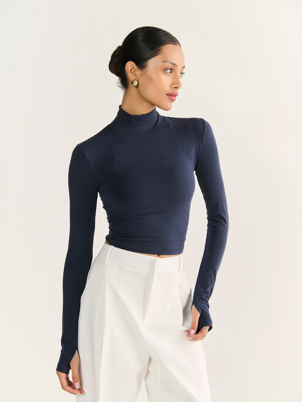 High Neck Long Sleeve Crop in Navy - front view on model