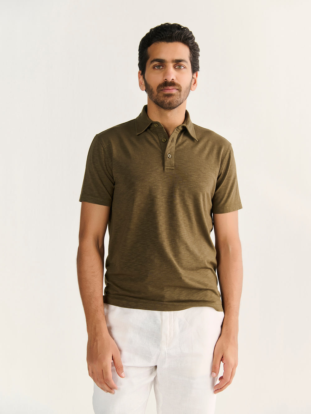 Textured Slub Short Sleeve Polo in Olive - front view on model