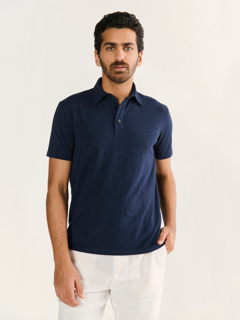 Textured Slub Short Sleeve Polo in Navy - front view on model